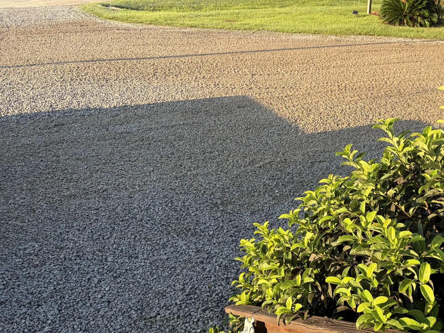 Gravel parking lot at a business, regraded and topped with fresh stone